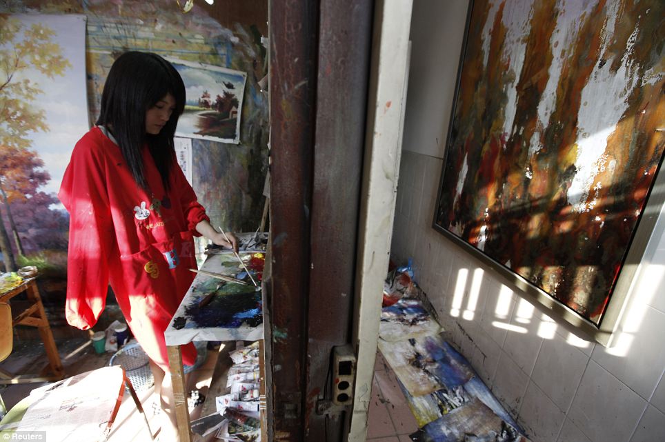 A painter, who has lost a right arm, works in her studio